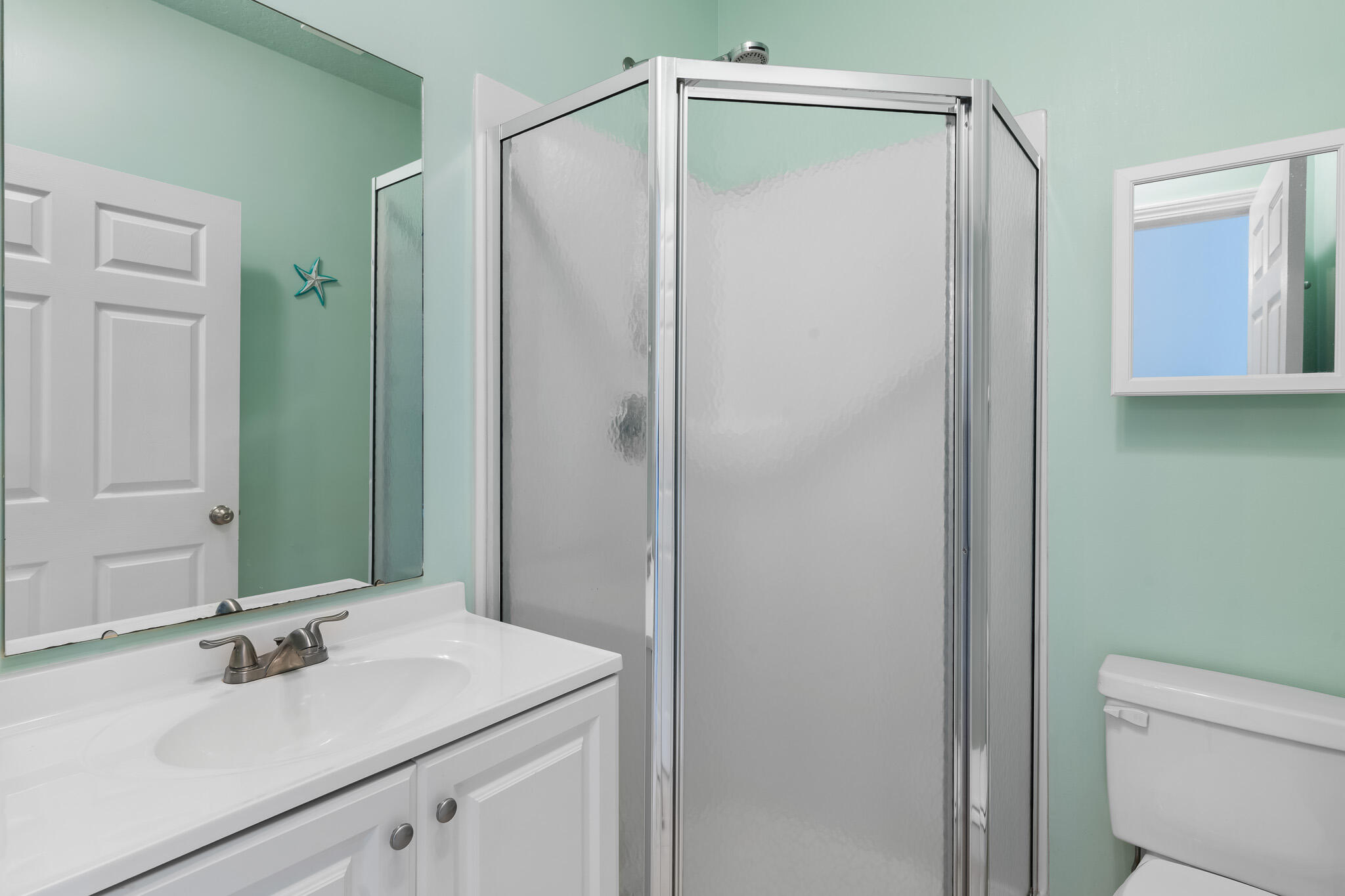 34 Heron's Watch Way, Unit 7205 Santa Rosa Beach, FL 32459 - Photo 27 of 49 a bathroom with a sink vanity mirror and toilet