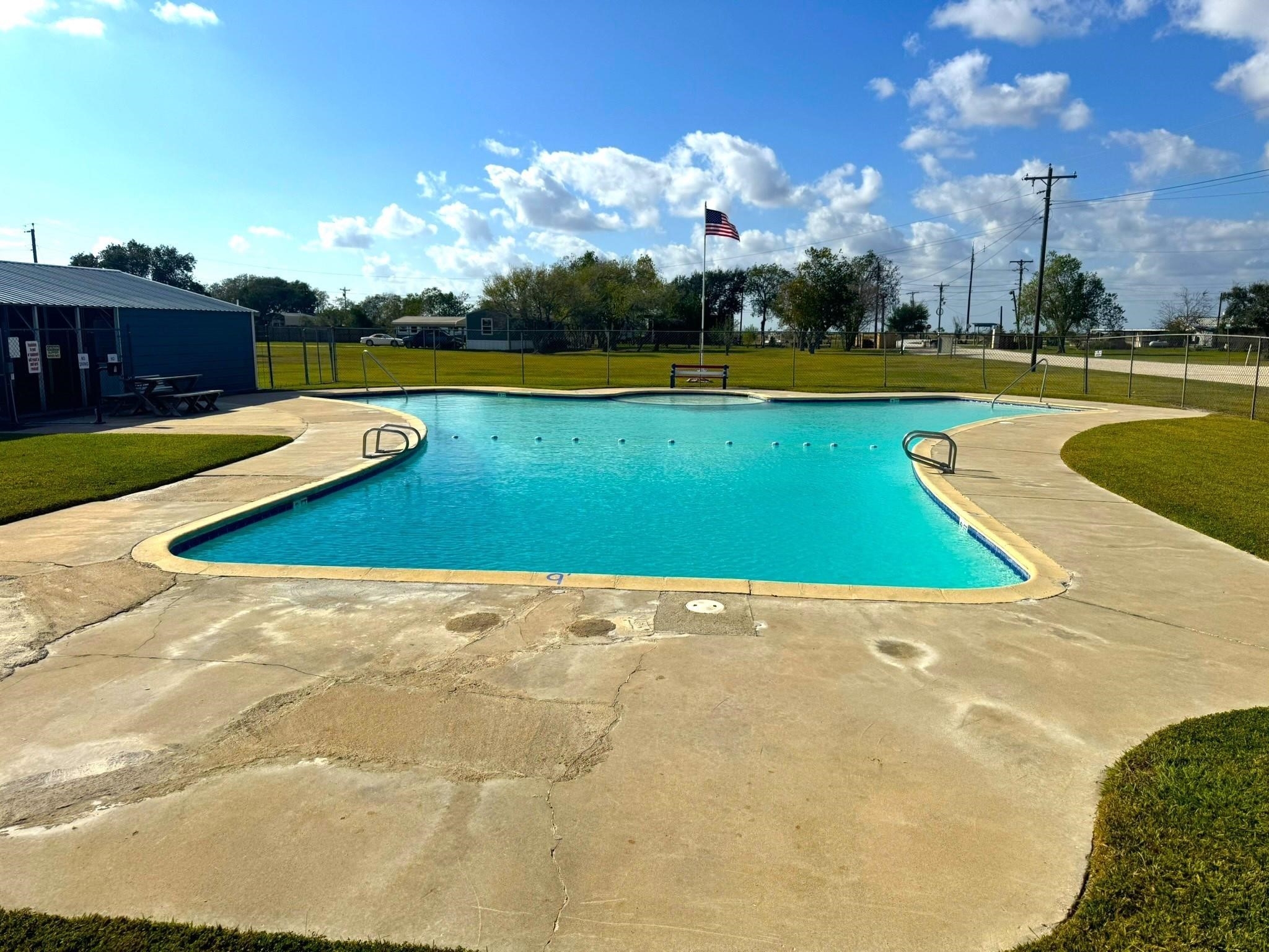 16 Meadowlark South Palacios, TX 77465 - Photo 12 of 22 a view of outdoor space swimming pool and lake view