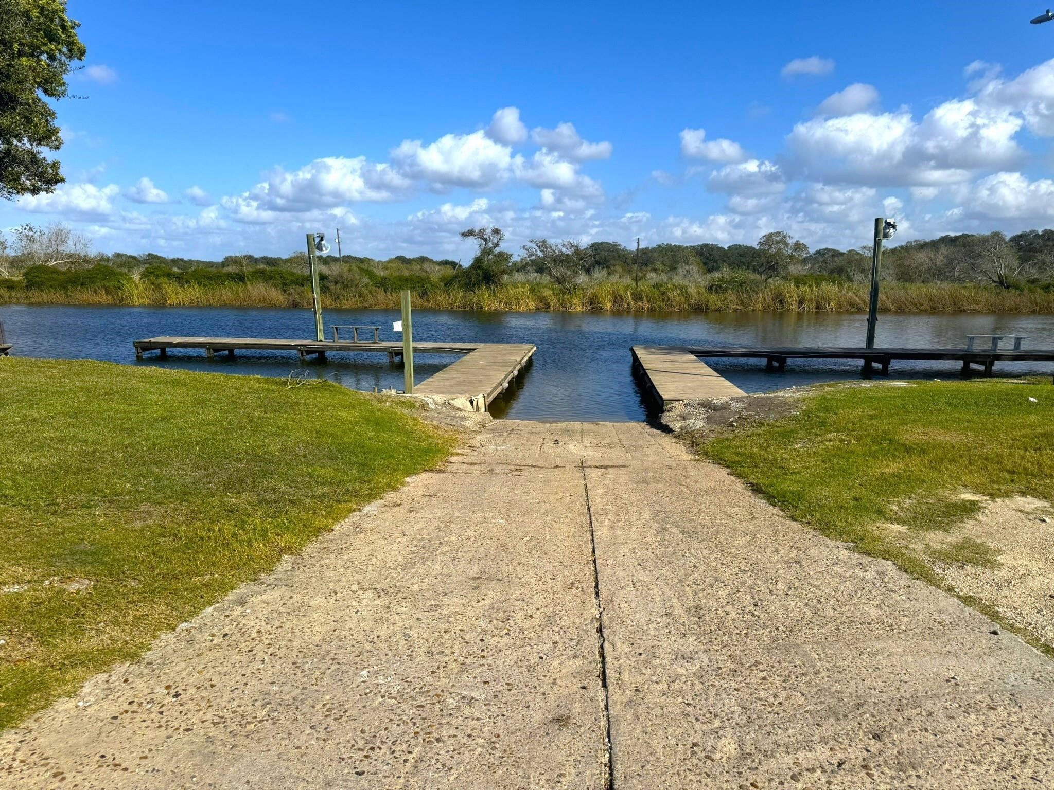 16 Meadowlark South Palacios, TX 77465 - Photo 14 of 22 a view of a lake with houses