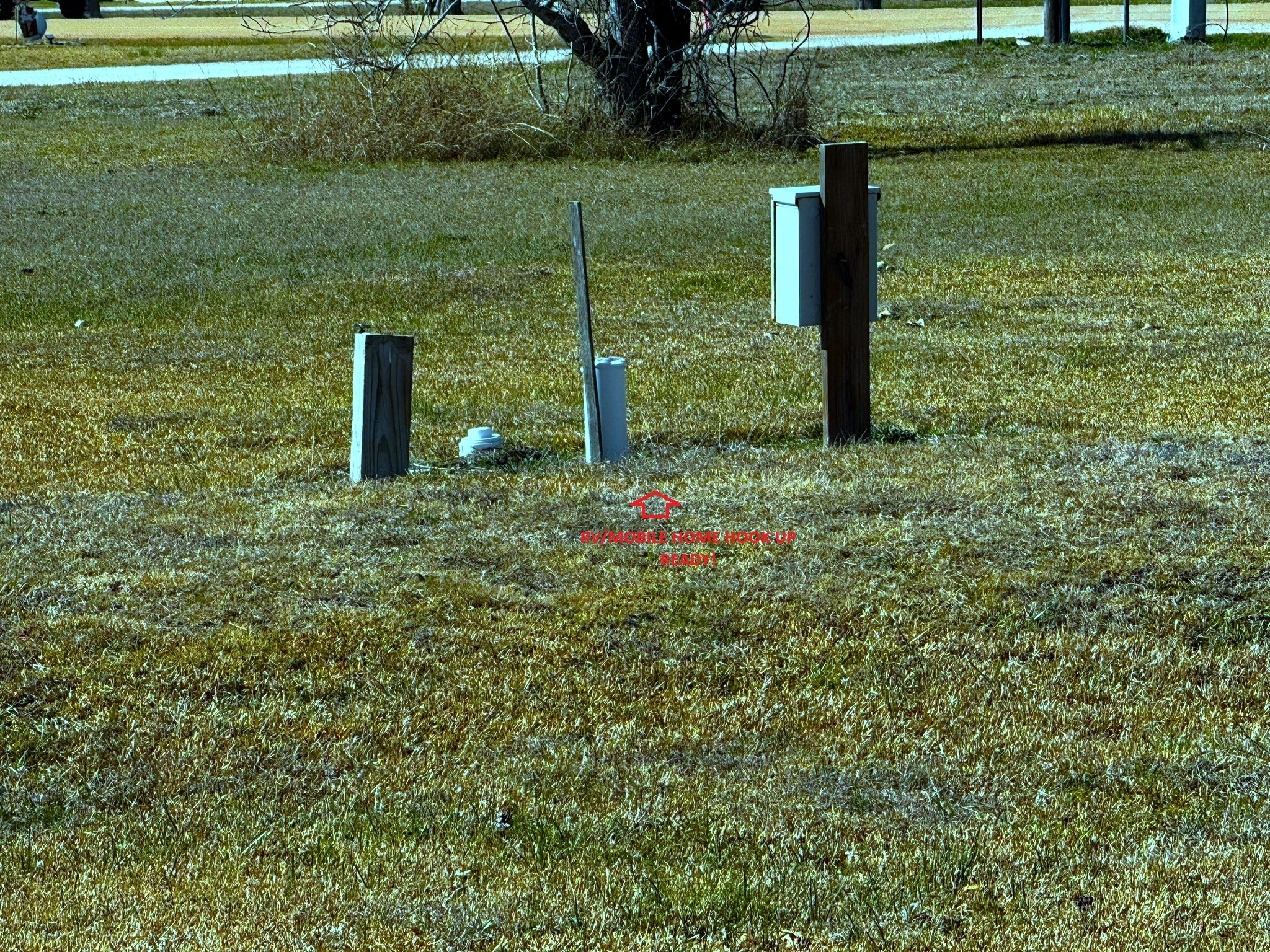 16 Meadowlark South Palacios, TX 77465 - Photo 3 of 22 a backyard of a house with lots of green space and fountain
