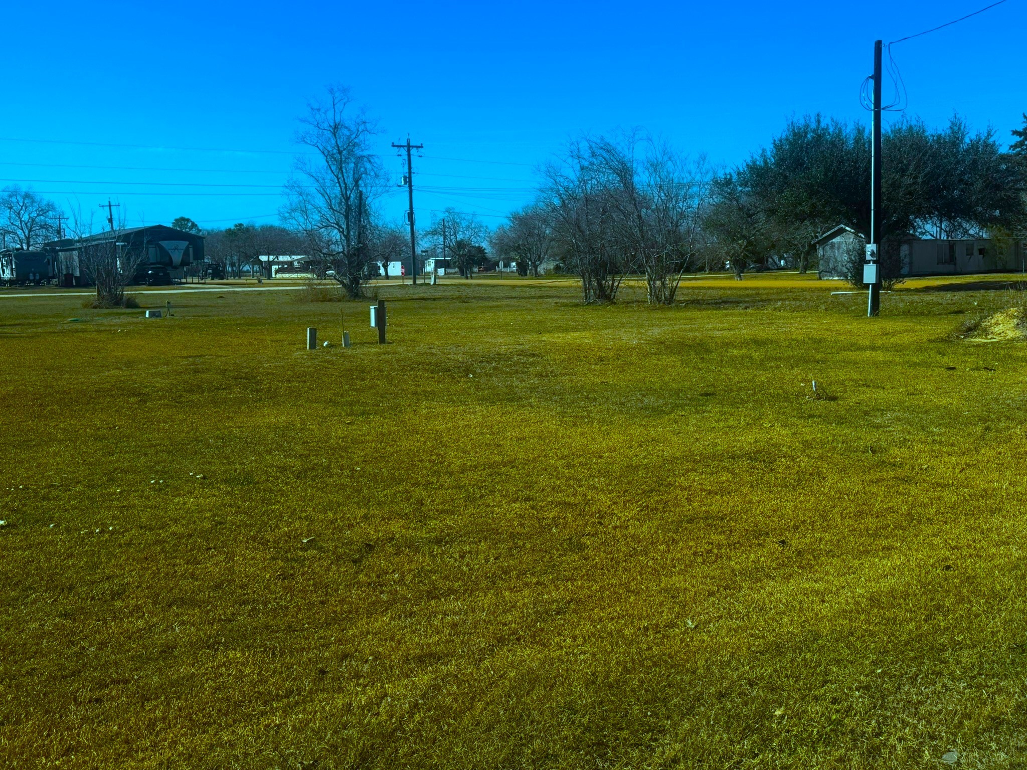 16 Meadowlark South Palacios, TX 77465 - Photo 4 of 22 a view of a golf course with a lake view