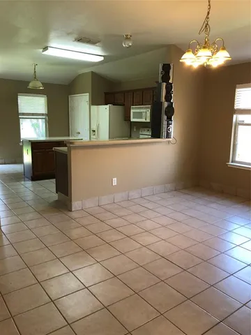 a bathroom with a sink vanity and mirror