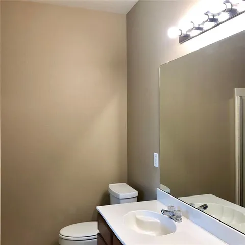 a bathroom with a sink and toilet