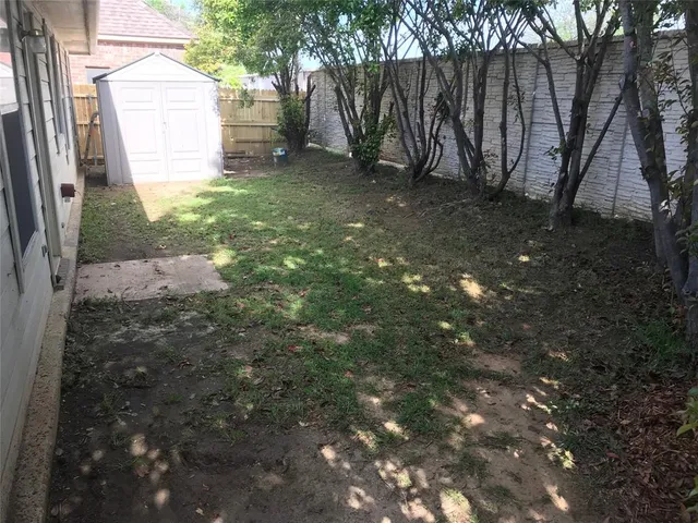 a backyard of a house with lots of green space