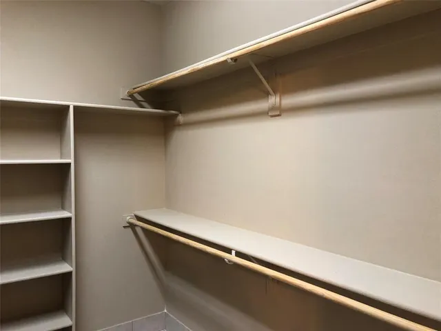 a view of an empty walk in closet