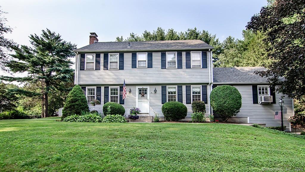 26 Meadowlark Road Simsbury, CT 06092 - Photo 1 of 1 a front view of a house with a garden