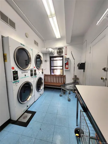 a storage room with washer and dryer