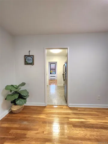 a view of a livingroom with wooden floor