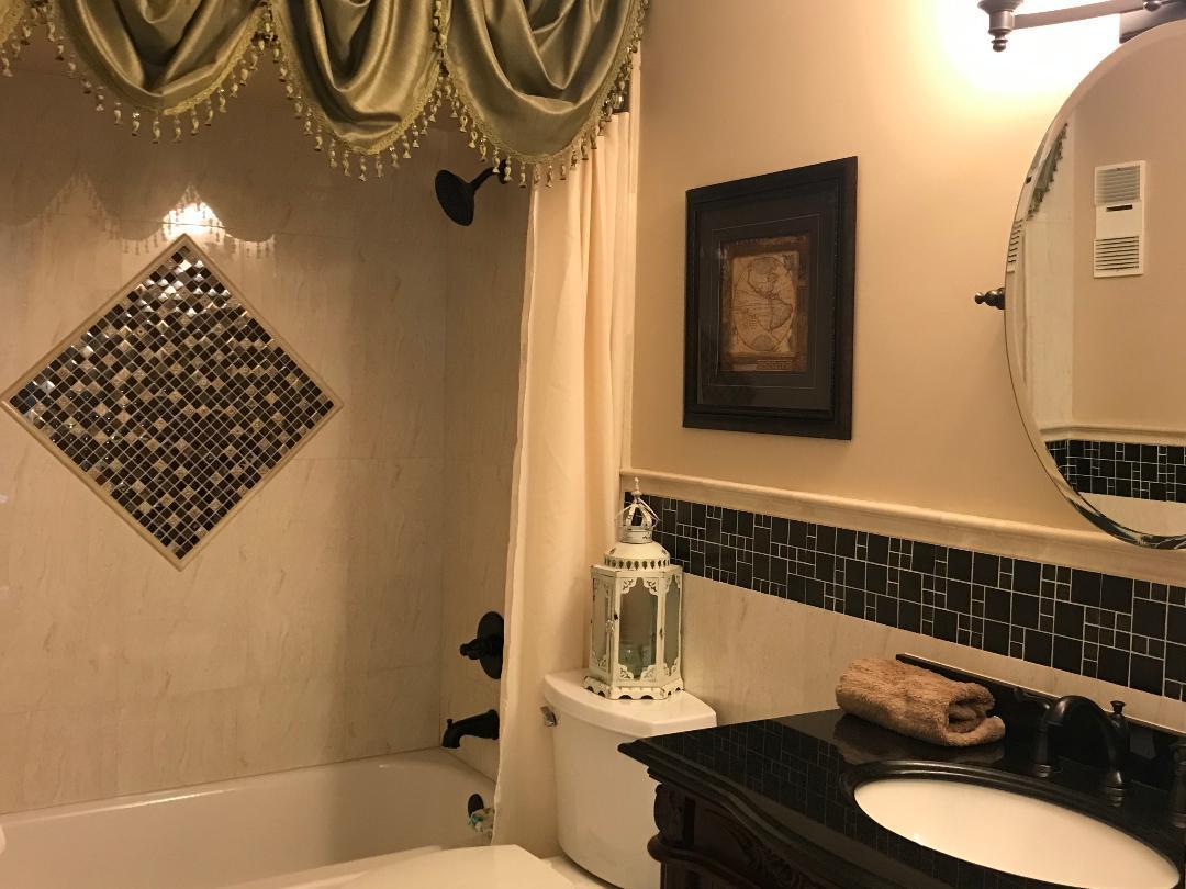 9005 Flynn Circle, Unit 1 Boca Raton, FL 33496 - Photo 26 of 31 Guest shower tile