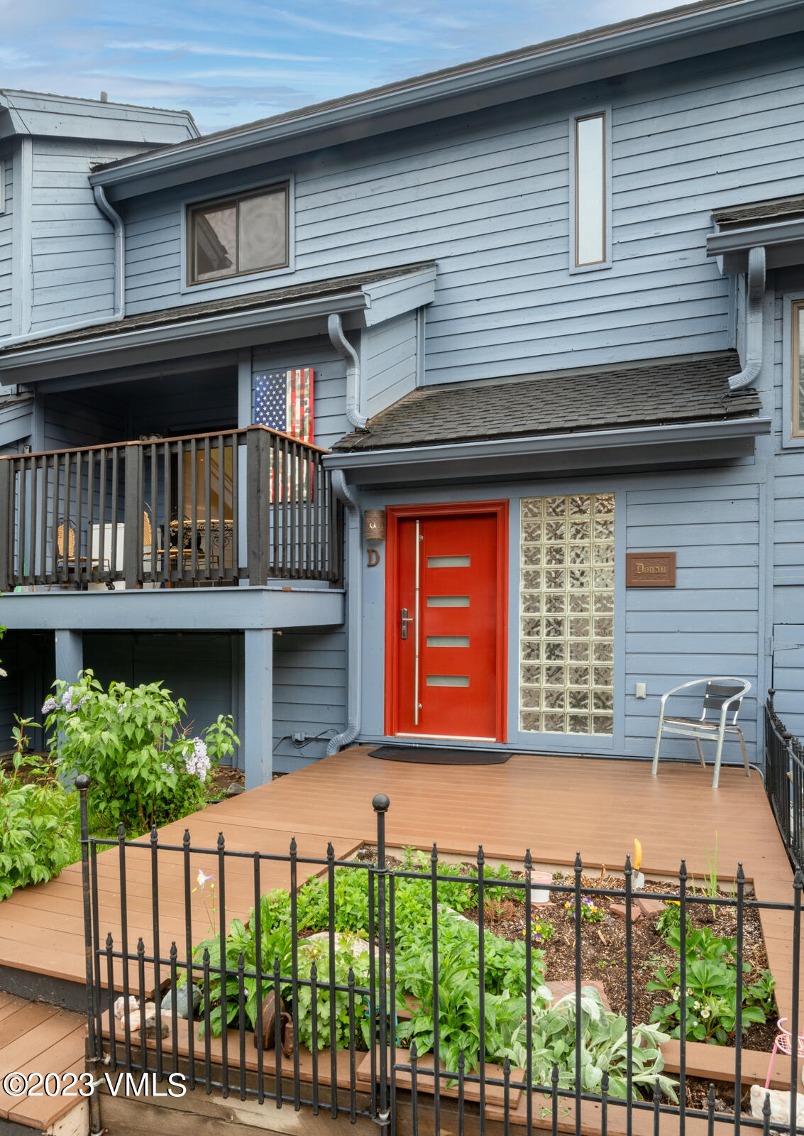 a front view of a house with large windows