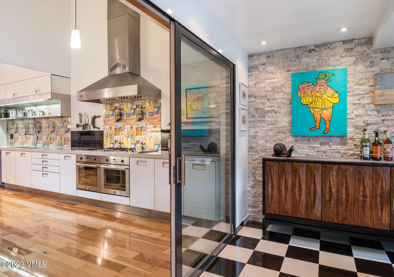 211 Nottingham Road, Unit D Avon, CO 81620 - Photo 11 of 35 a kitchen with stainless steel appliances kitchen island granite countertop a refrigerator and a stove top oven