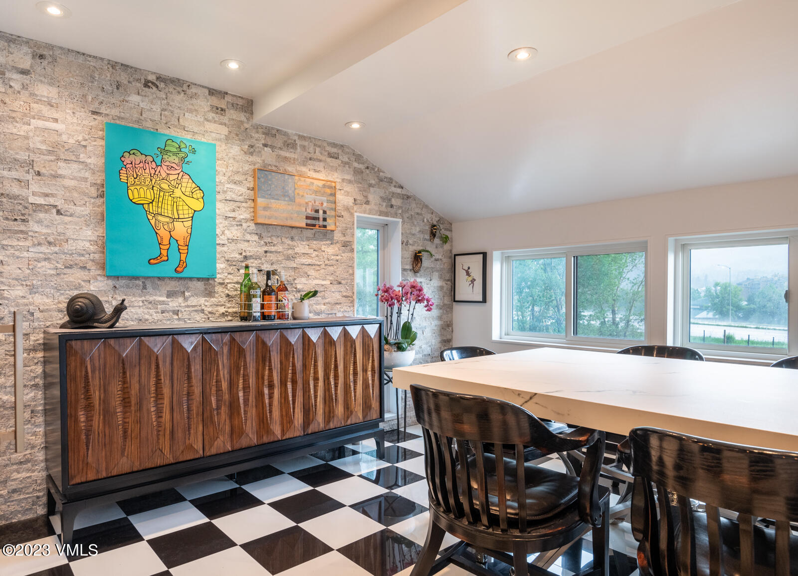 211 Nottingham Road, Unit D Avon, CO 81620 - Photo 12 of 35 a dining room with furniture and a floor to ceiling window