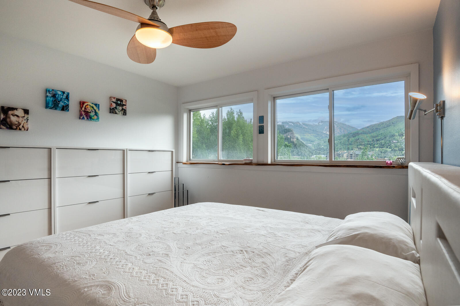 211 Nottingham Road, Unit D Avon, CO 81620 - Photo 15 of 35 a bedroom with a bed and a large window