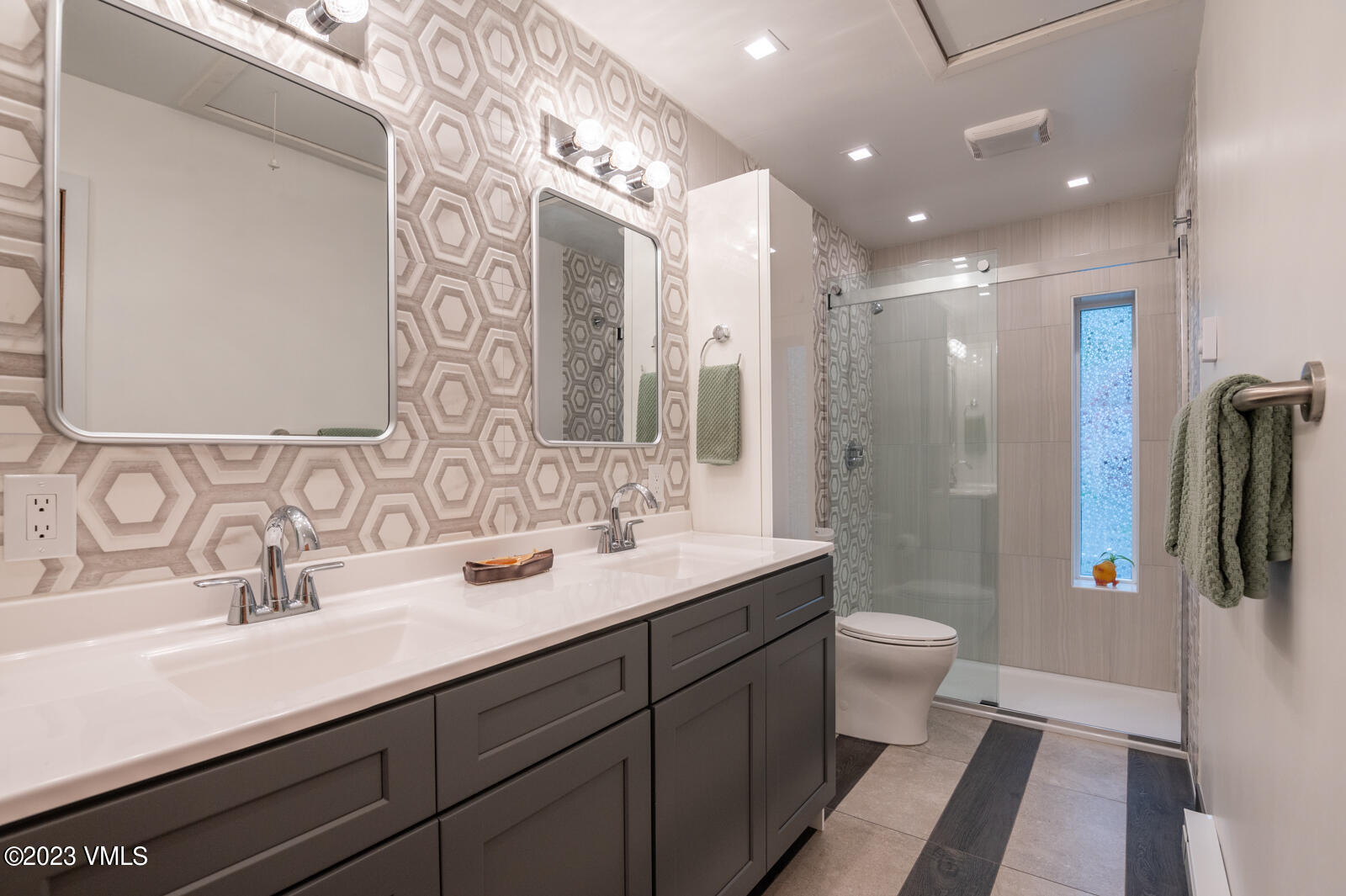 211 Nottingham Road, Unit D Avon, CO 81620 - Photo 17 of 35 a bathroom with a double vanity sink toilet and shower