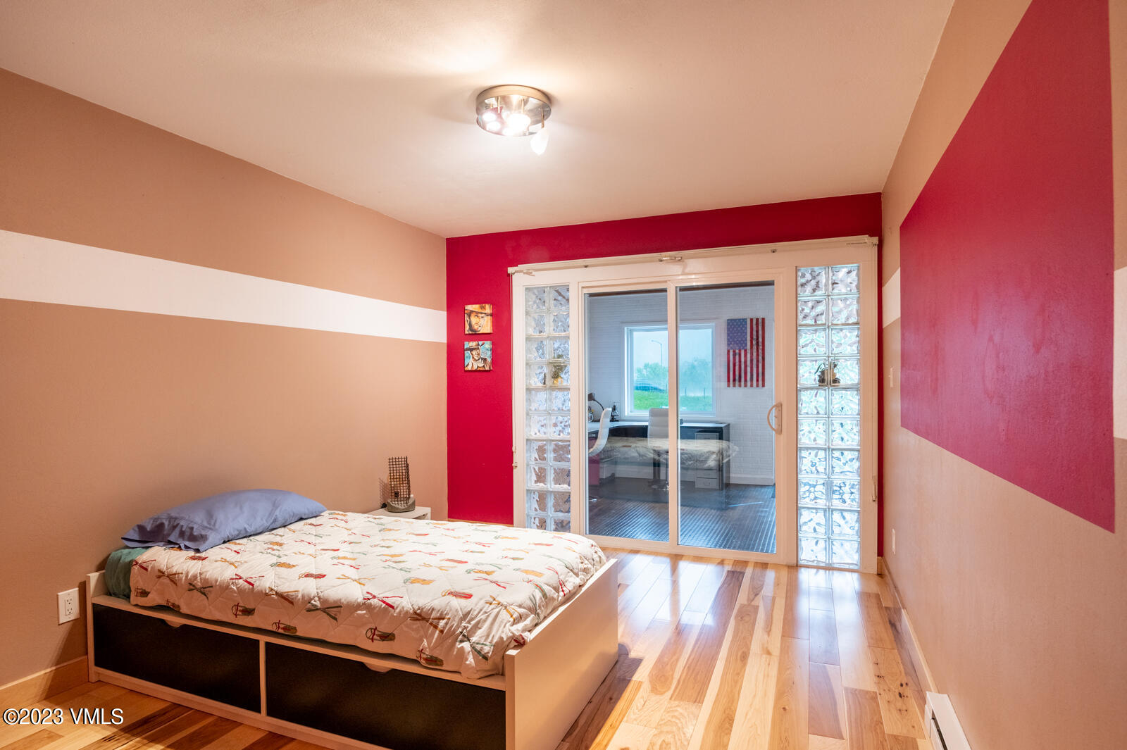 211 Nottingham Road, Unit D Avon, CO 81620 - Photo 28 of 35 a bedroom with a bed and a table