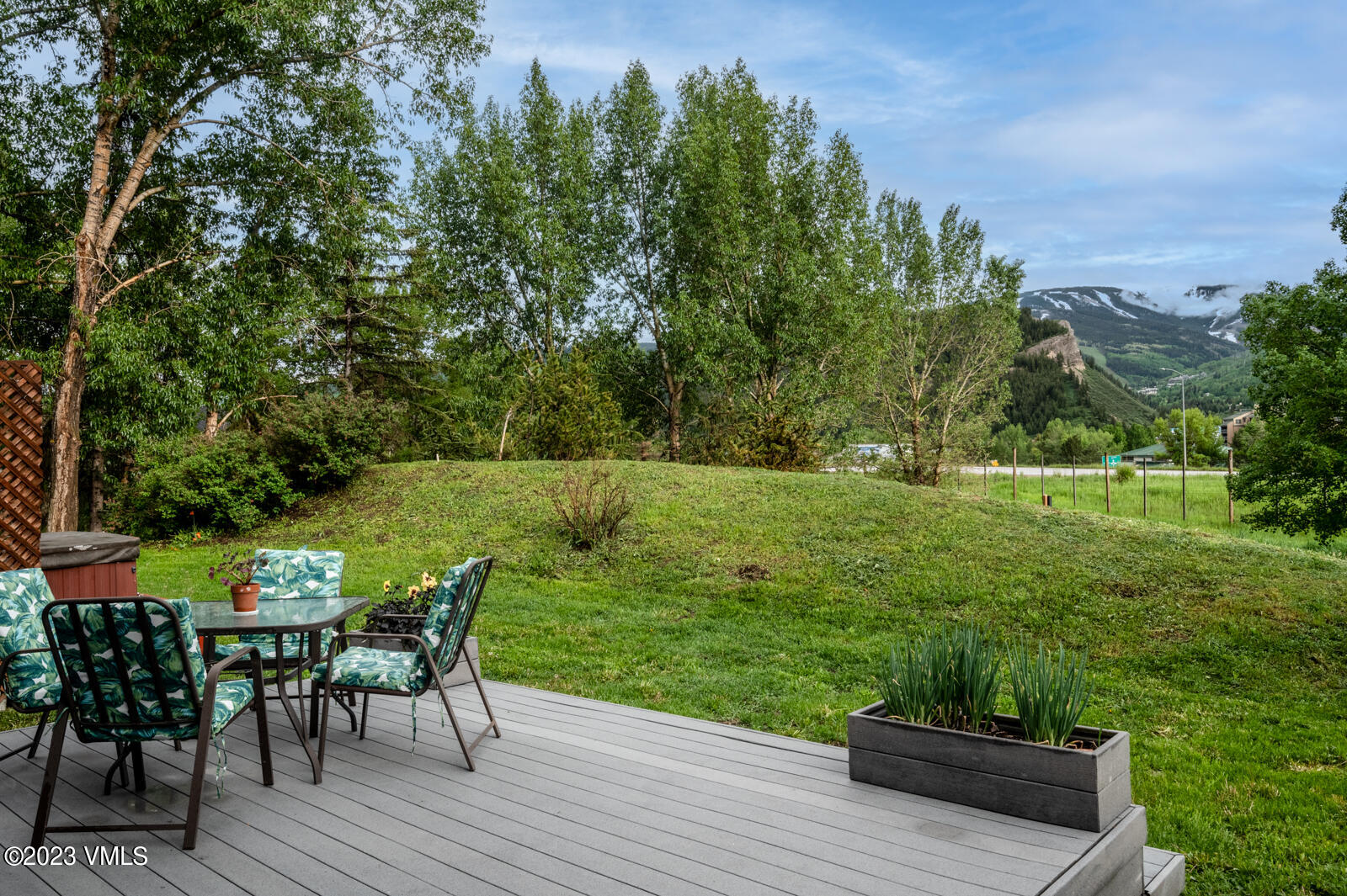 211 Nottingham Road, Unit D Avon, CO 81620 - Photo 3 of 35 a view of a chairs and table on the wooden deck