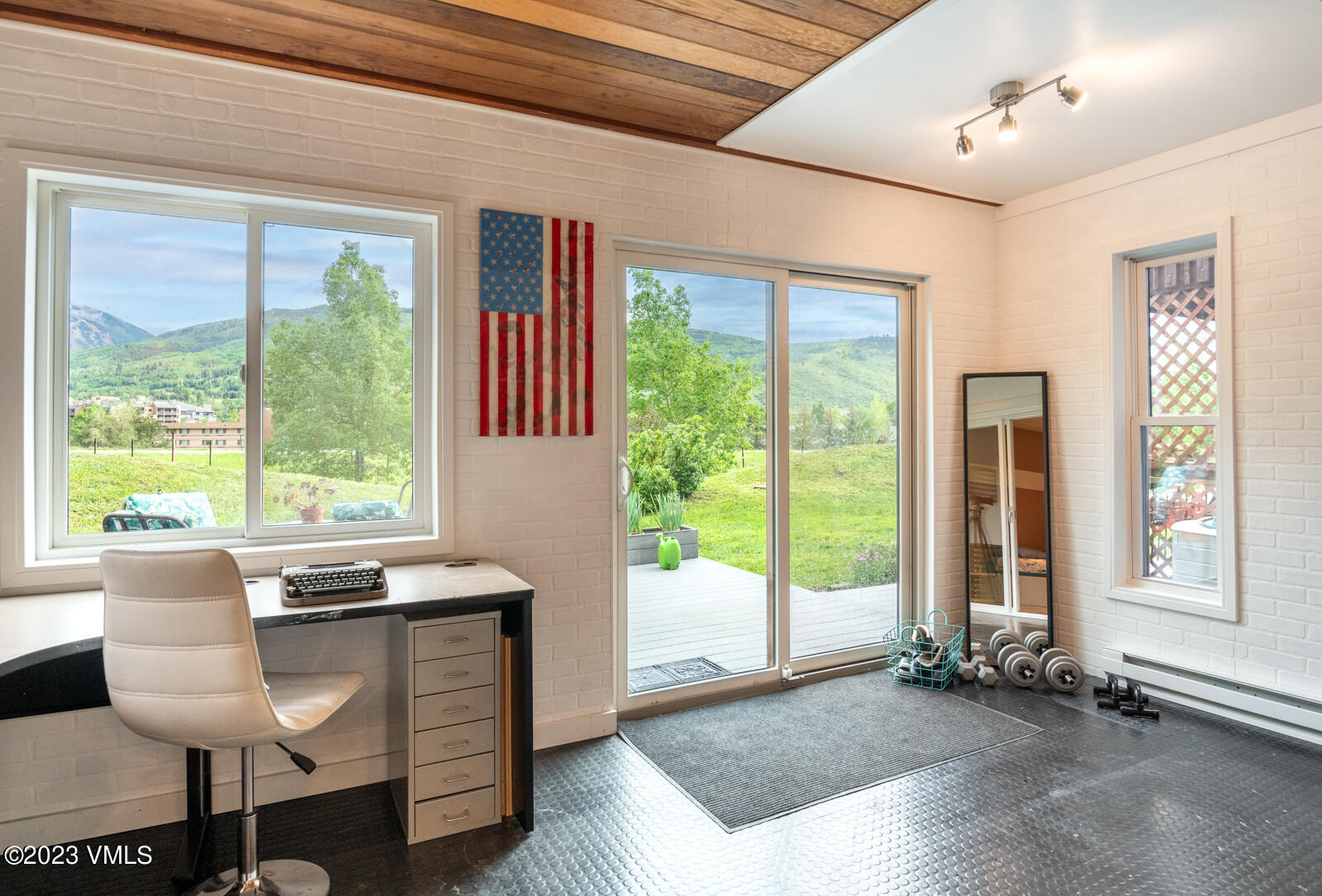 211 Nottingham Road, Unit D Avon, CO 81620 - Photo 31 of 35 a view of a livingroom with furniture wooden floor and a window