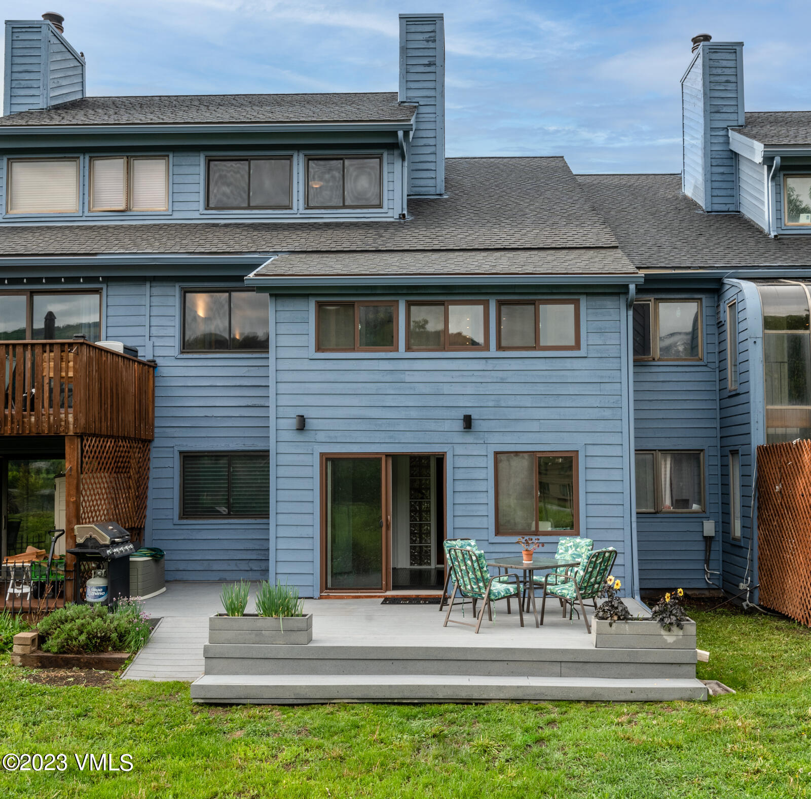 211 Nottingham Road, Unit D Avon, CO 81620 - Photo 33 of 35 a front view of a house with a garden and patio