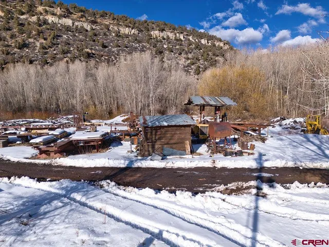 a view of a town with cars parked