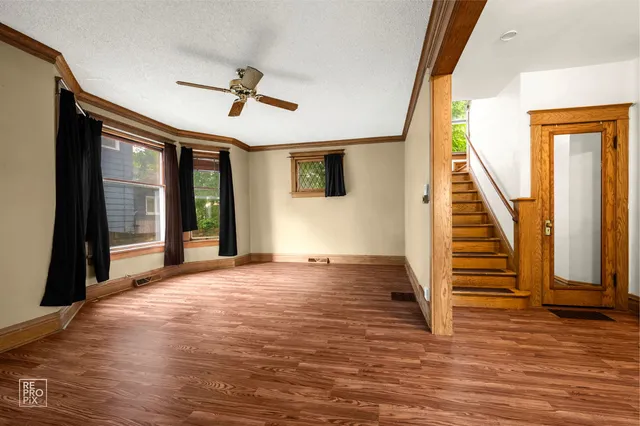 a view of entryway and hall with wooden floor
