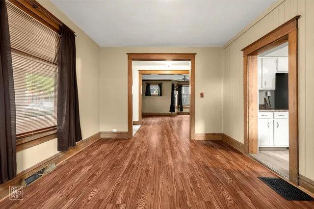 a view of a room with wooden floor a fireplace
