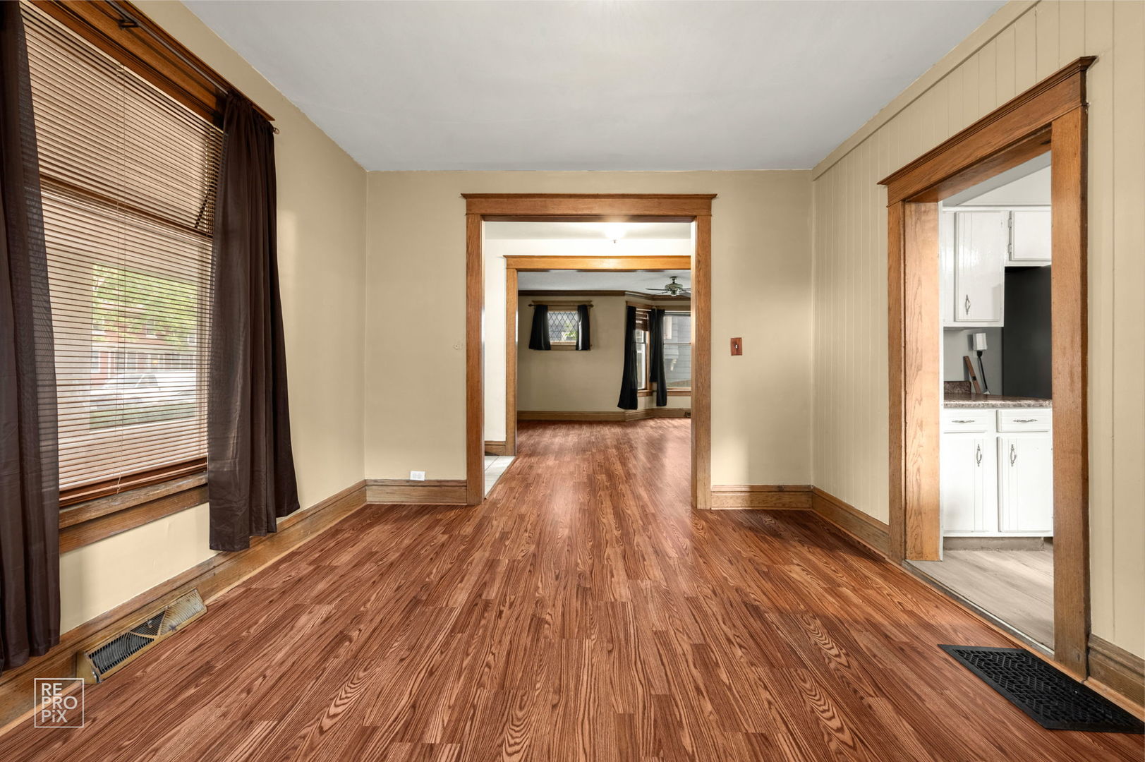 534 Palace Street Aurora, IL 60506 - Photo 3 of 12 a view of a room with wooden floor a fireplace