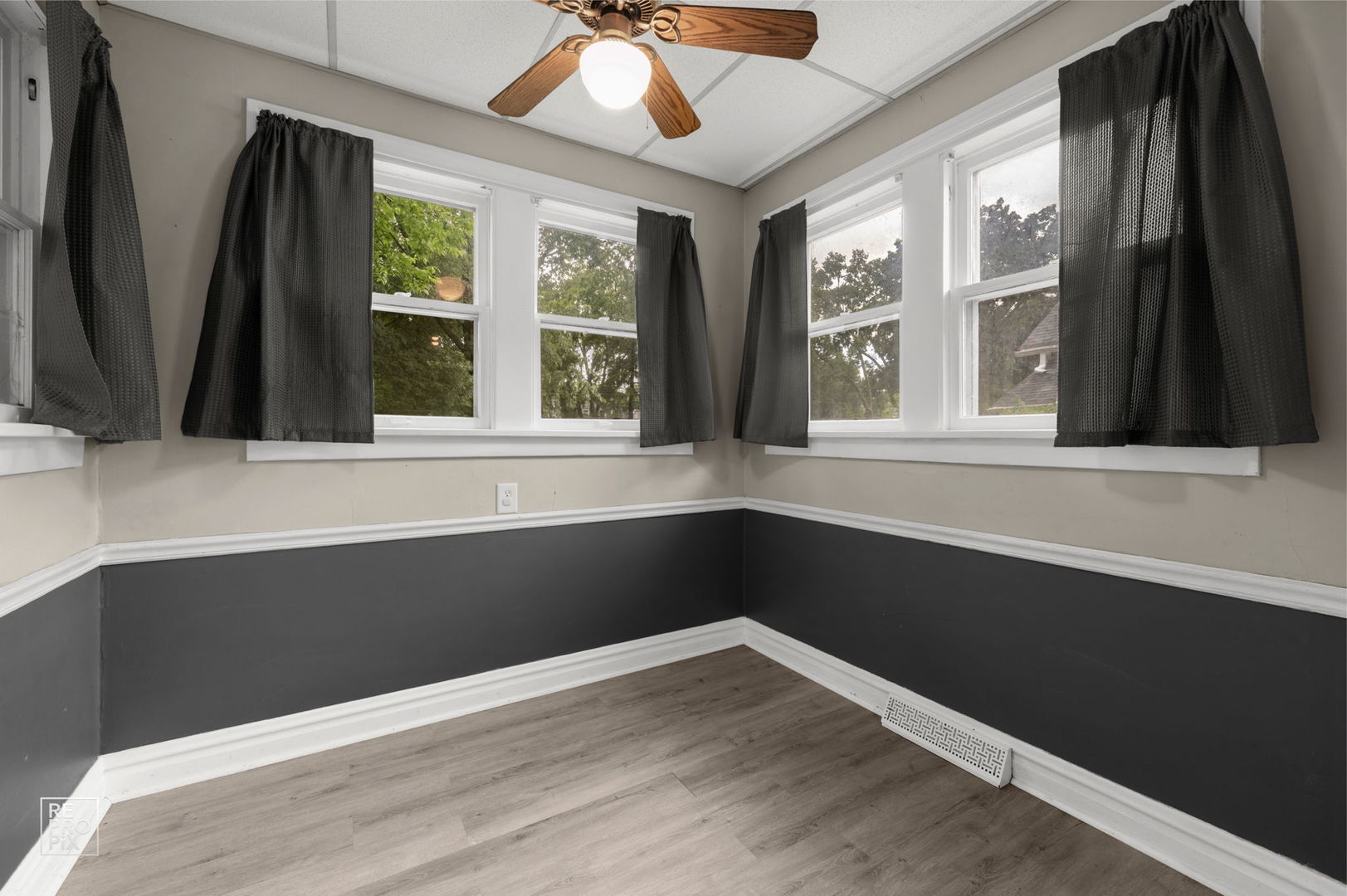 534 Palace Street Aurora, IL 60506 - Photo 5 of 12 a view of an empty room with wooden floor and a window