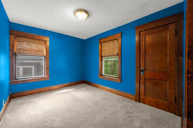 a view of empty room with windows