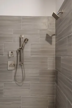 a bathroom with a shower and toilet