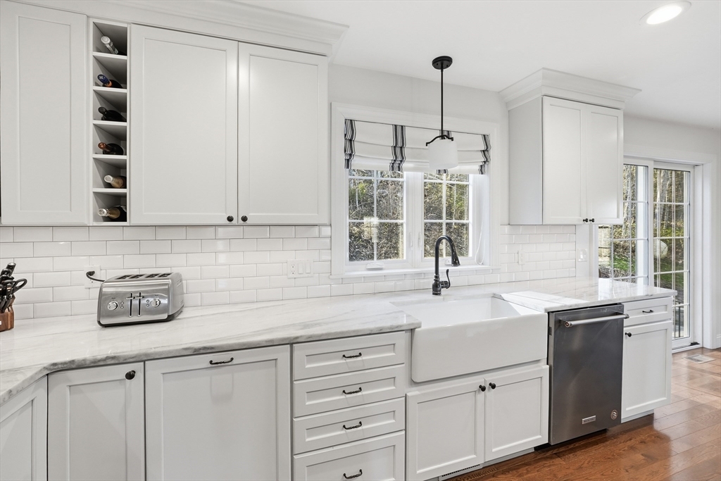 103 Rice Corner Road Brookfield, MA 01506 - Photo 7 of 39 a kitchen with cabinets appliances a sink and a window