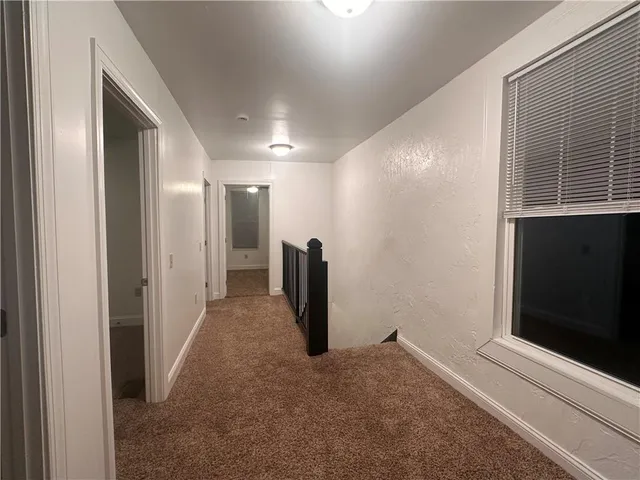 a view of a hallway with closet