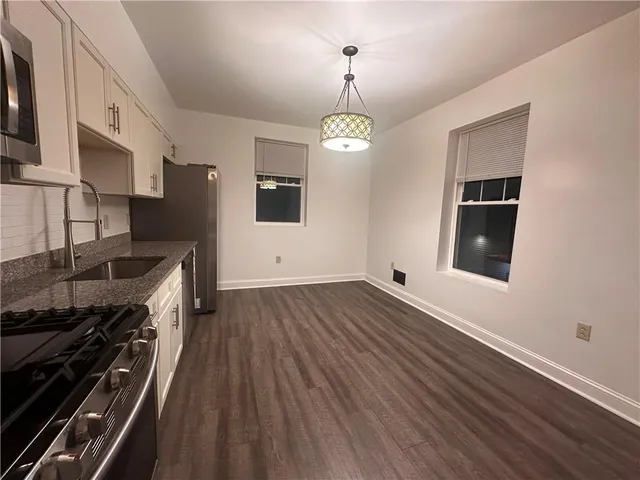 a kitchen with stainless steel appliances a stove oven and a refrigerator