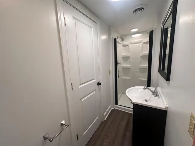 a bathroom with a sink and a mirror