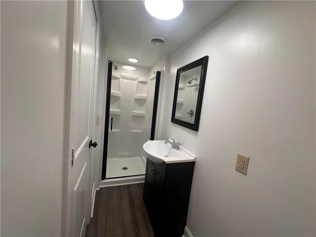 a bathroom with a sink and mirror