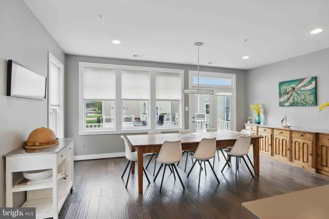 a dining room with furniture window wooden floor
