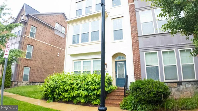 a view of a brick building next to a yard