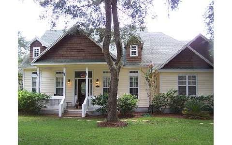 87574 Roses Bluff Road Yulee, FL 32097 - Photo 1 of 1 a front view of a house with a yard