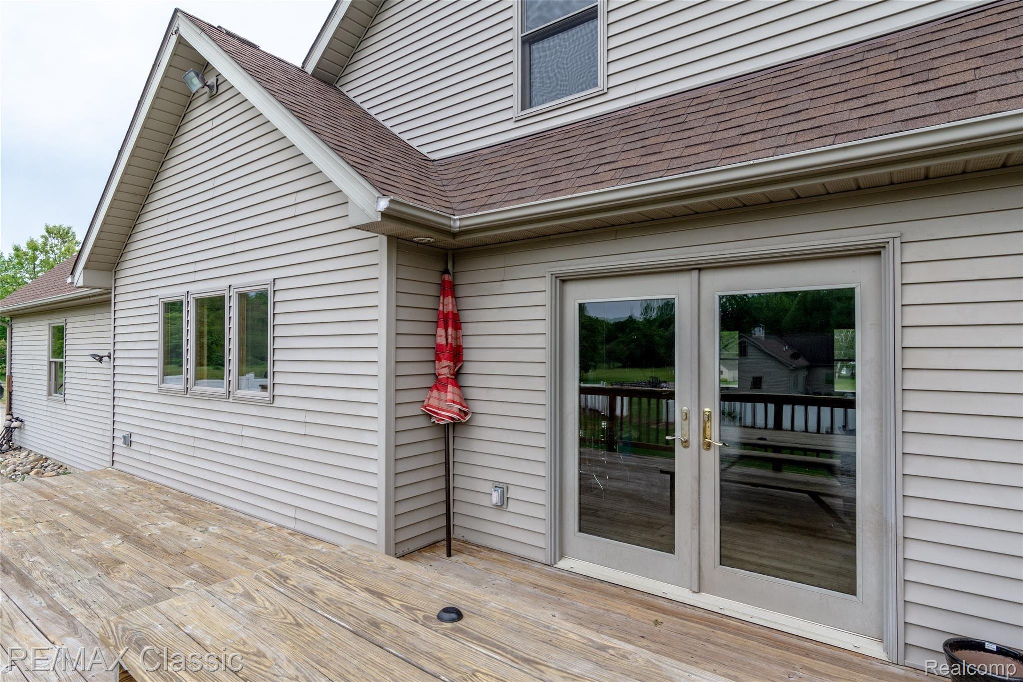 5765 Stanley Road Columbiaville, MI 48421 - Photo 34 of 40 Large deck to entertain on