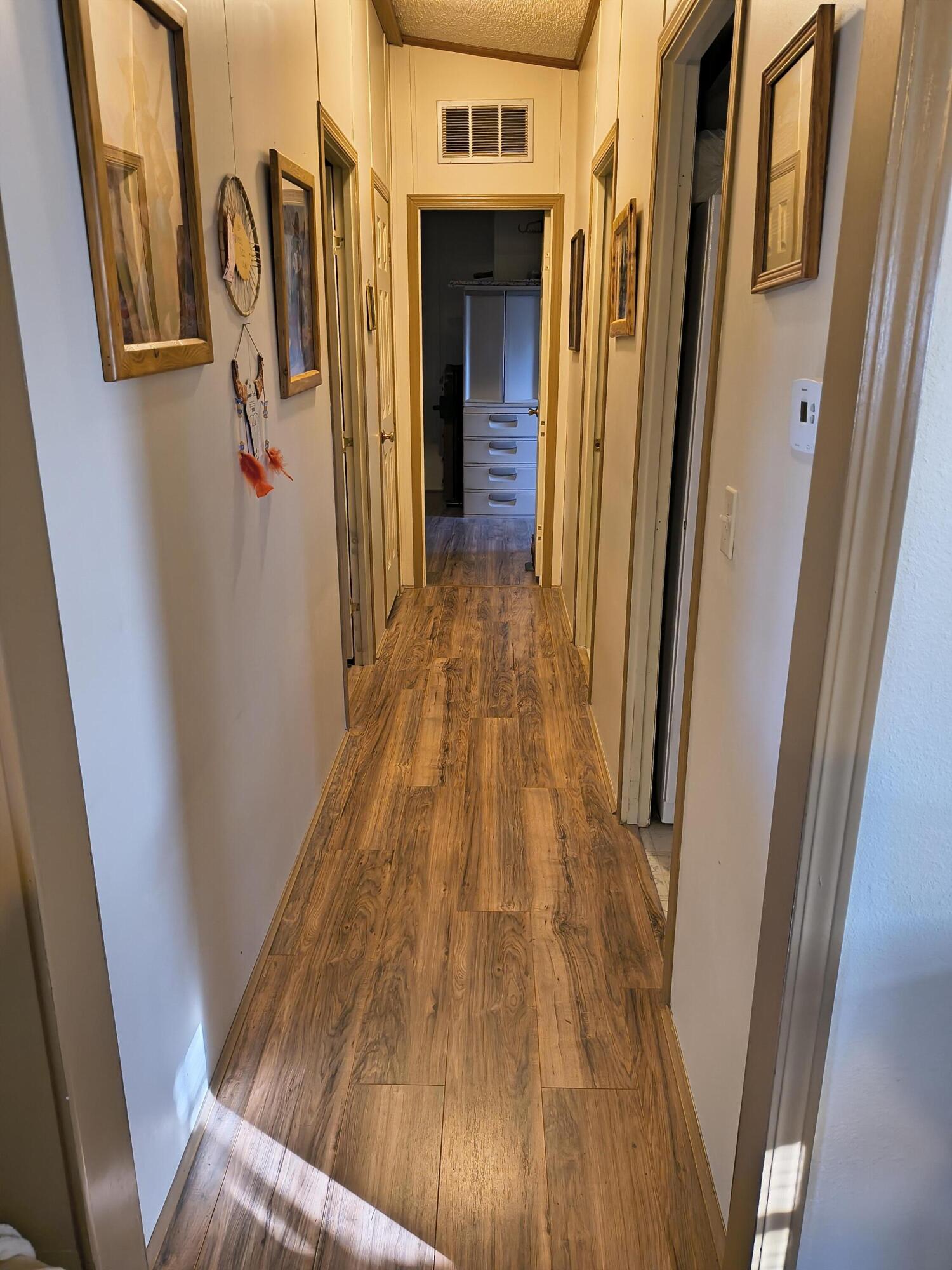 235 North Roosevelt Street Merrill, OR 97633 - Photo 16 of 27 a view of walk in closet with wooden floor