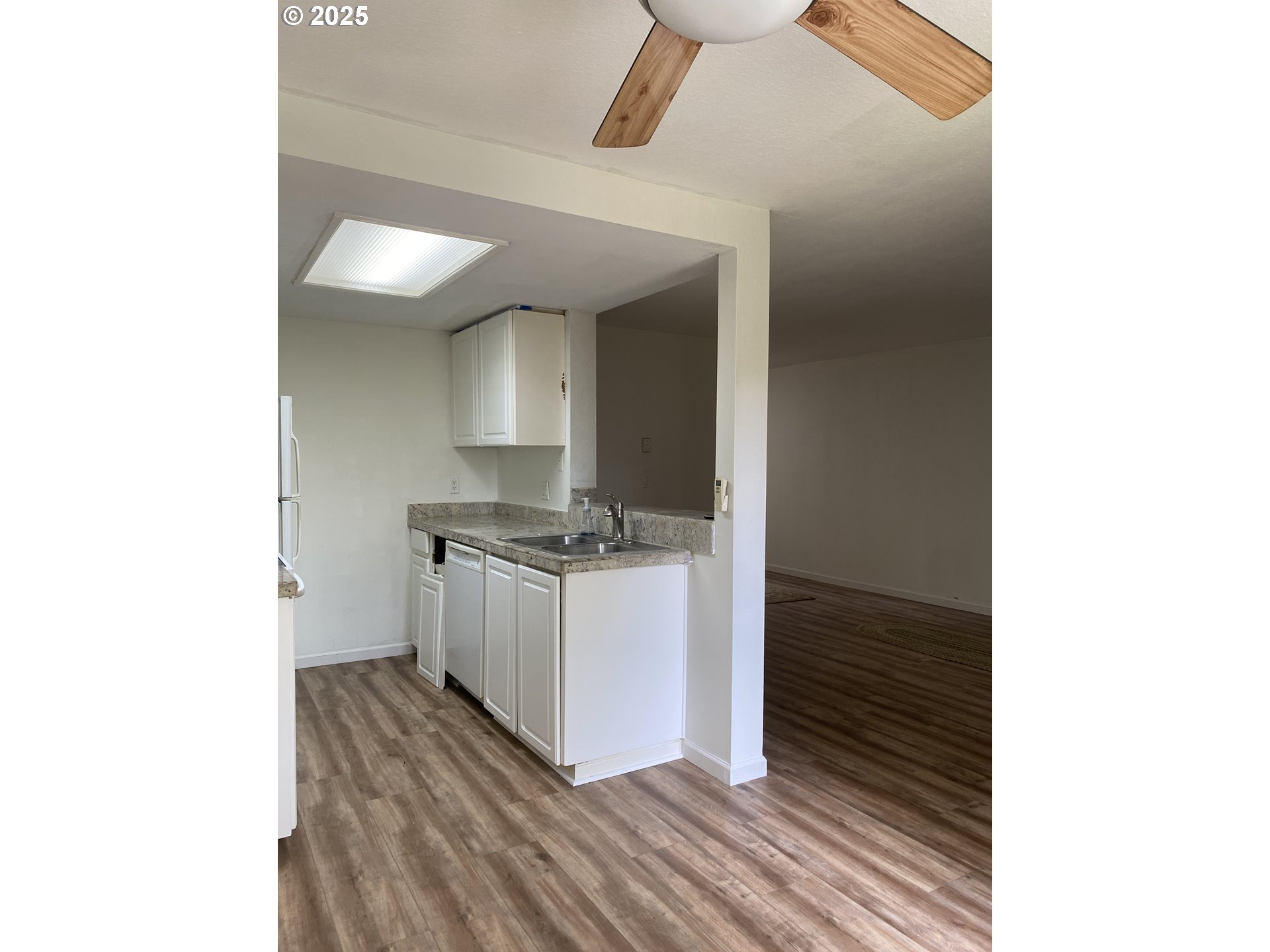 9872 Southeast Talbert Street Clackamas, OR 97015 - Photo 12 of 38 a kitchen with a sink and cabinets