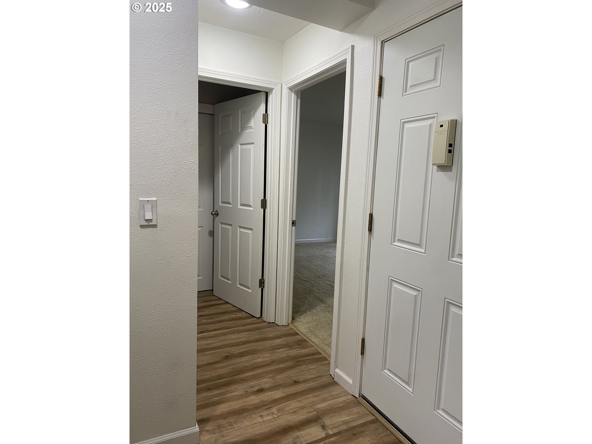 9872 Southeast Talbert Street Clackamas, OR 97015 - Photo 14 of 38 a view of a hallway with wooden floor