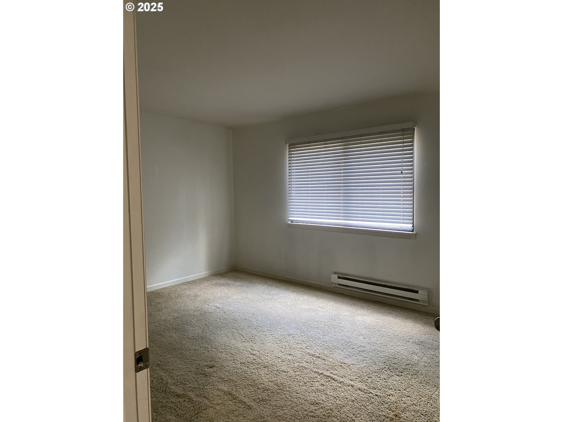 9872 Southeast Talbert Street Clackamas, OR 97015 - Photo 15 of 38 a view of an empty room with a window