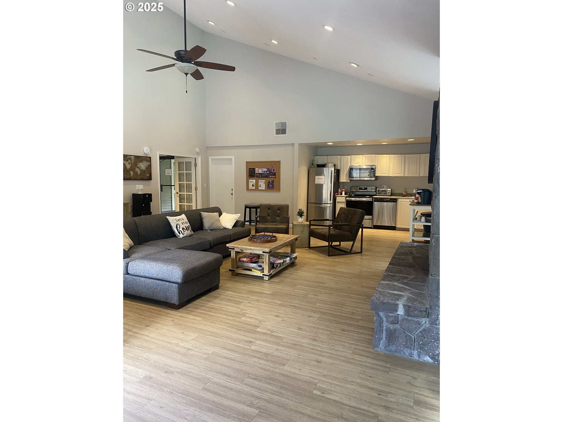 9872 Southeast Talbert Street Clackamas, OR 97015 - Photo 32 of 38 a living room with furniture and a wooden floor