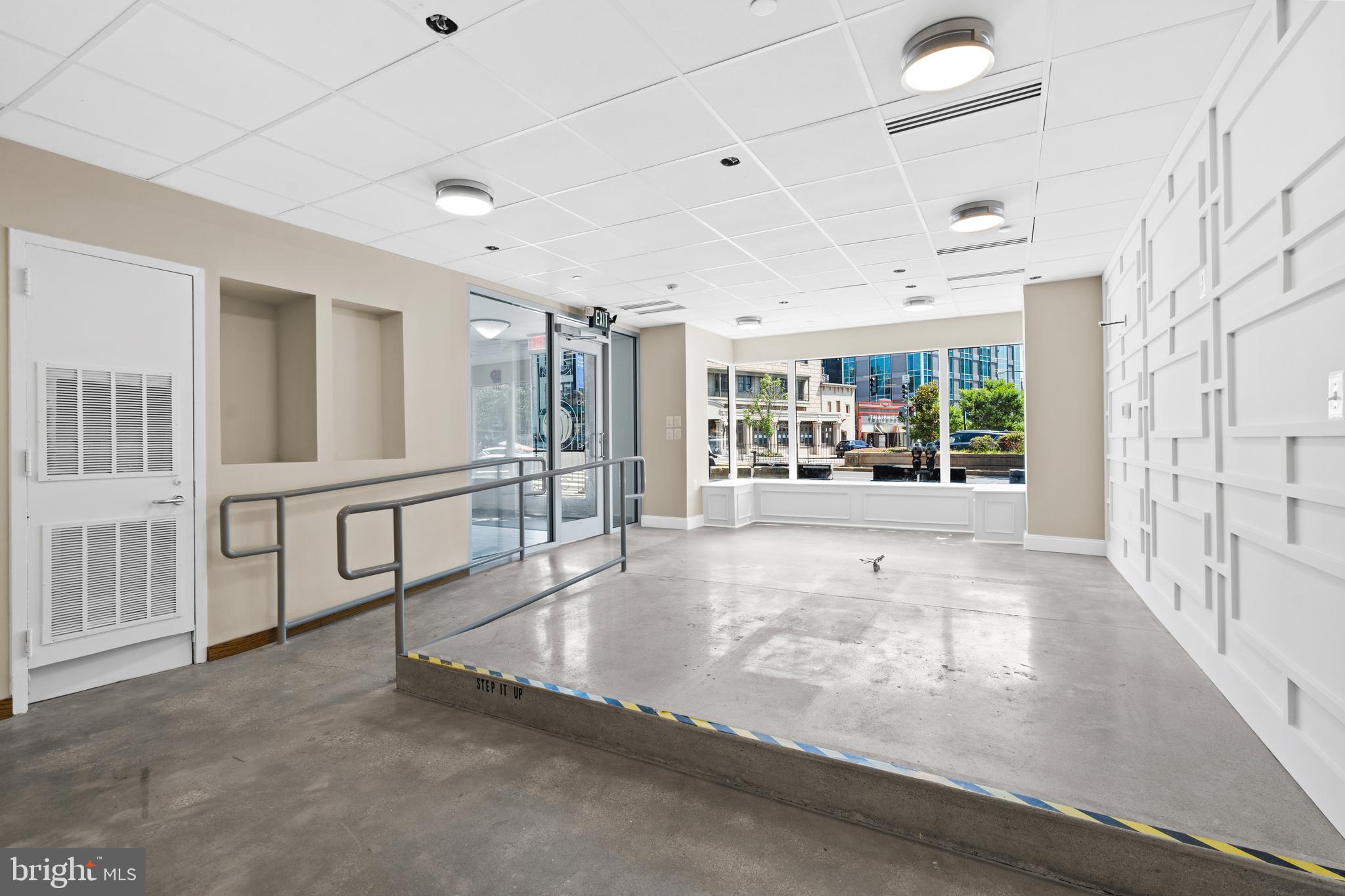2040 South Street Northwest Washington, DC 20009 - Photo 15 of 19 a view of an entryway with a floor to ceiling window and a kitchen