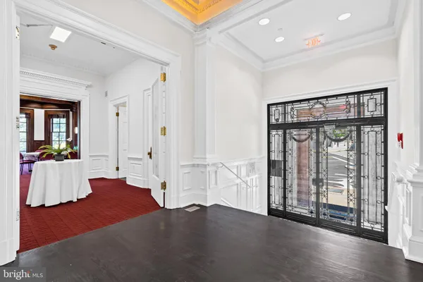 a view of an entryway with wooden floor
