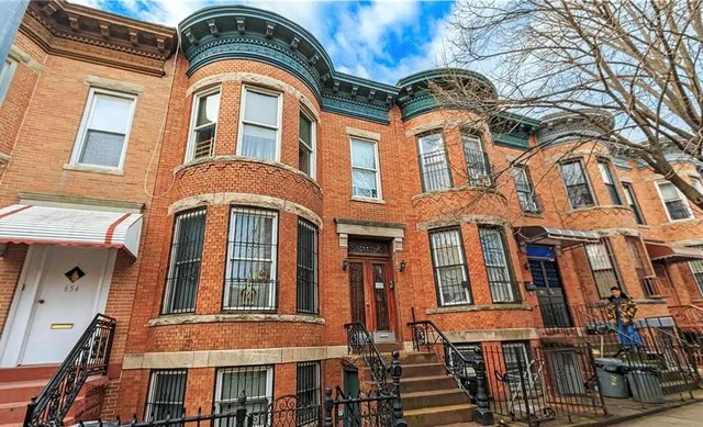 a front view of a multi story residential apartment building