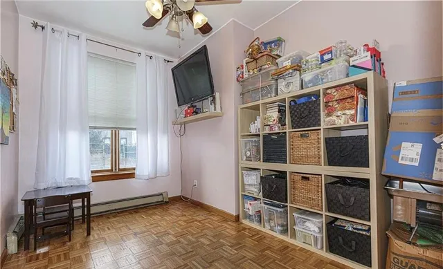 a view of a livingroom with furniture and a window