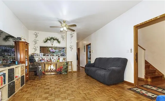 a living room with furniture a dining table and a piano table