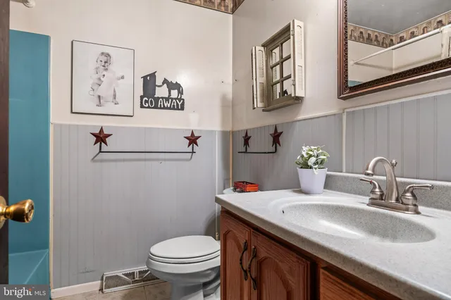 a view of a house with a yard and a garden