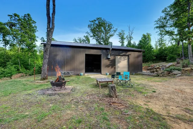 a view of a patio with table and chairs